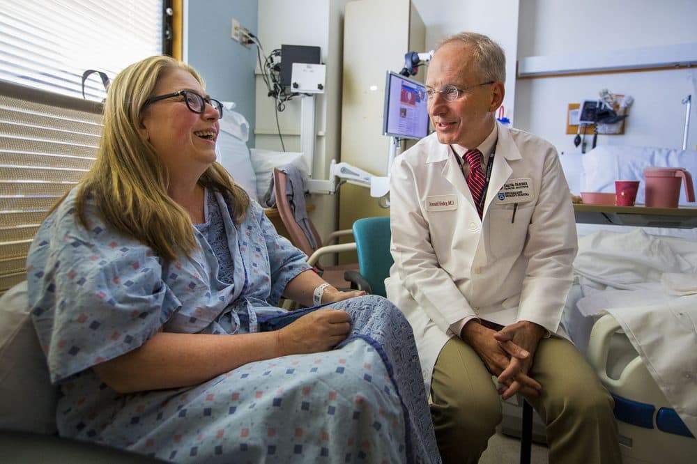 Julie Waldman and her physician, Dr. Ronald Bleday, discuss what to expect during her recovery from colon surgery, at Boston's Brigham and Women's Hospital. (Jesse Costa/WBUR)