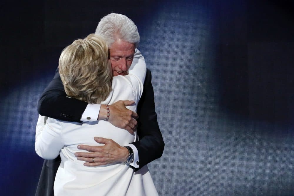 Former President Bill Clinton hugs his wife Democratic presidential nominee Hillary Clinton during the final day of the Democratic National Convention in Philadelphia , Thursday, July 28, 2016. (J. Scott Applewhite/AP)
