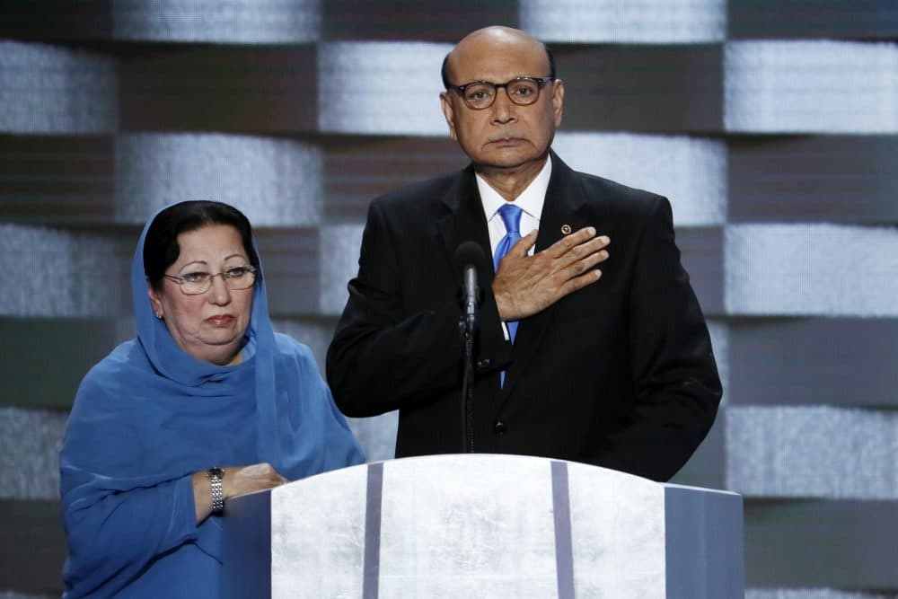 In this Thursday, July 28, 2016 file photo, Khizr Khan, father of fallen US Army Capt. Humayun S. M. Khan and his wife Ghazala speak during the final day of the Democratic National Convention in Philadelphia. Republican presidential nominee Donald Trump broke a major American political and societal taboo over the weekend when he engaged in an emotionally-charged feud with Khizr and Ghazala Khan, the bereaved parents of a decorated Muslim Army captain killed by a suicide bomber in Iraq. He further stoked outrage by implying Ghazala Khan did not speak while standing alongside her husband at last week's Democratic convention because they are Muslim. (J. Scott Applewhite/AP)