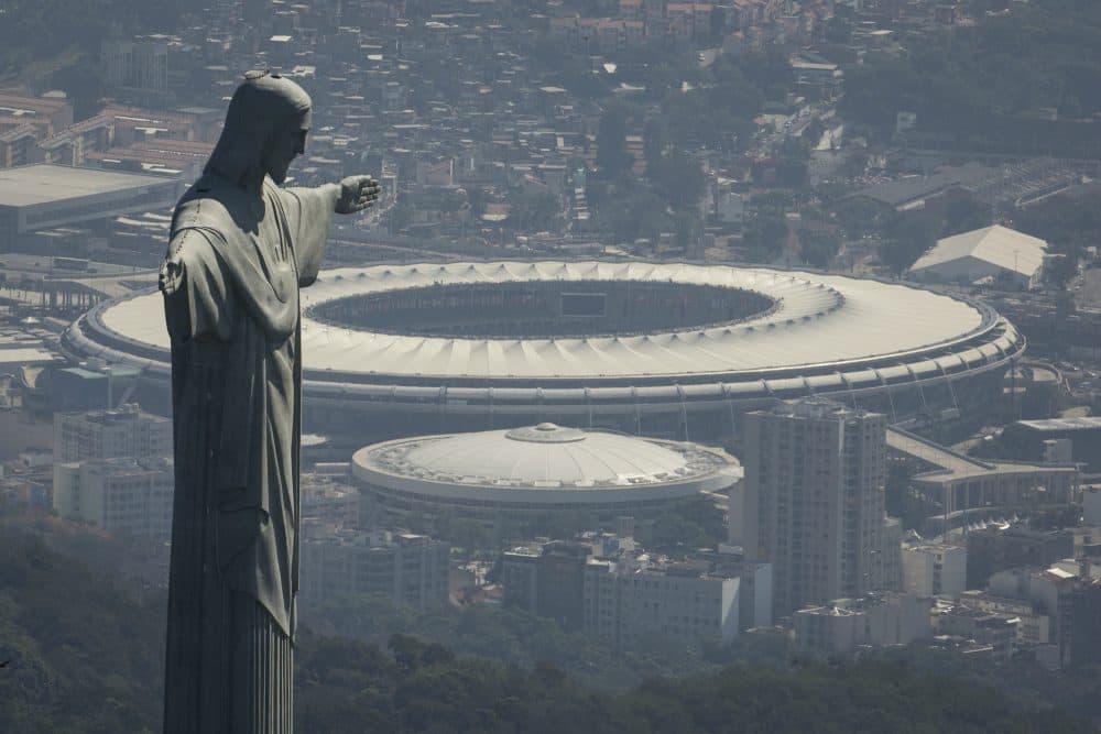 The Christ the Redeemer statue stands above Maracana stadium in Rio de Janeiro, Brazil, Monday, Aug. 1, 2016. The Summer Olympics start Aug. 5. (Felipe Dana/AP)