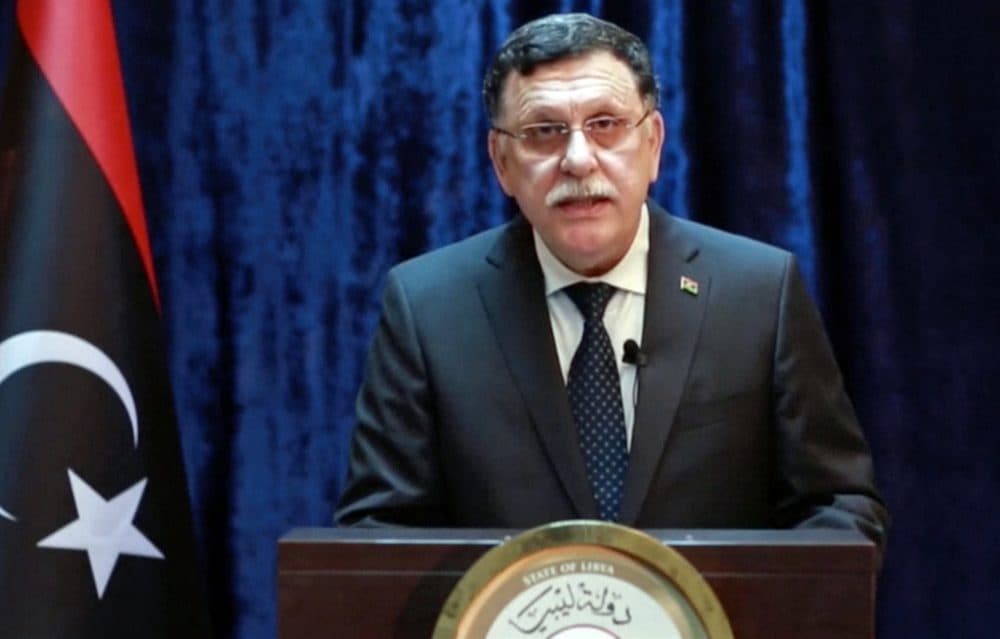In this Monday, Aug. 1, 2016 frame grab from video by the Libyan Government Media Office, Fayez Serraj, the head of Libya's U.N.-brokered presidency council, makes a statement on Libyan TV announcing that American warplanes attacked the IS bastion of Sirte on the Mediterranean Sea, in northern Libya. (Libyan Government Media Office via AP)