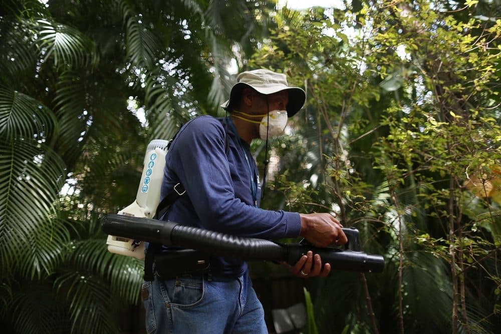 Larry Smart, a Miami-Dade County mosquito control inspector, uses a fogger to spray pesticide to kill mosquitos in the Wynwood neighborhood as the county fights to control a Zika virus outbreak on Aug. 1, 2016 in Miami, Florida. (Joe Raedle/Getty Images)