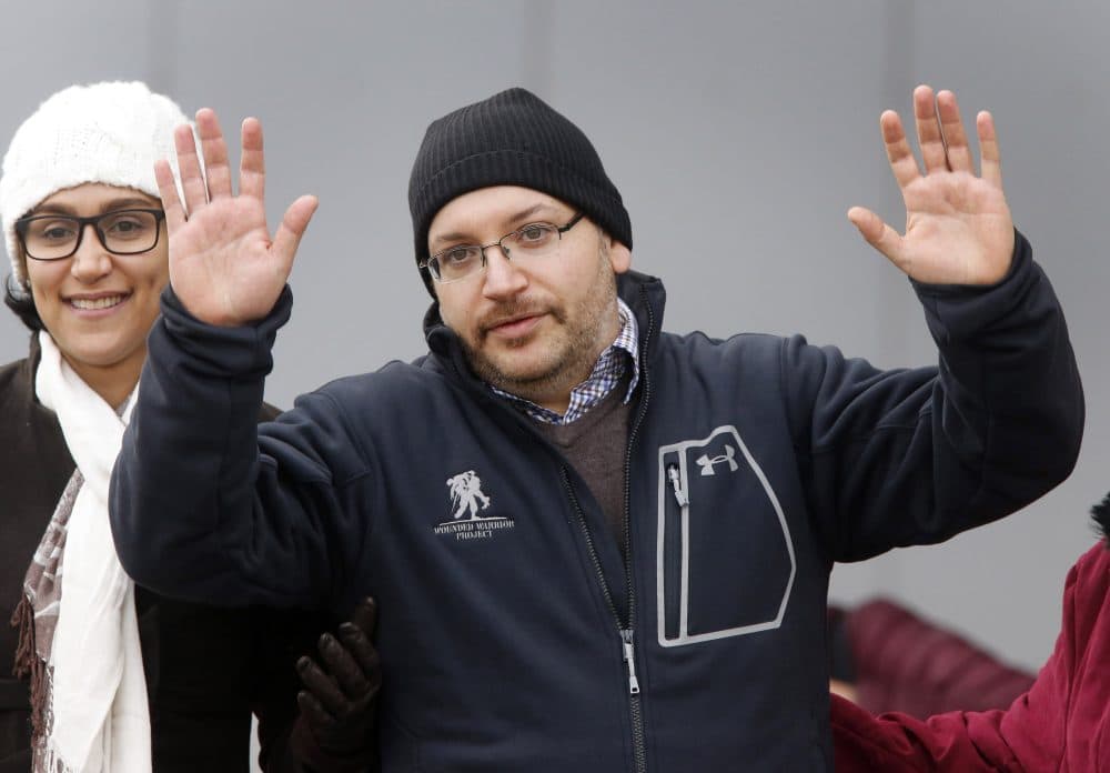 U.S. journalist Jason Rezaian gestures next to his wife Yeganeh Salehi as he poses for media people in front of Landstuhl Regional Medical Center in Landstuhl, Germany, Wednesday, Jan. 20, 2016, shortly after being released from an Iranian prison. (Michael Probst/AP)