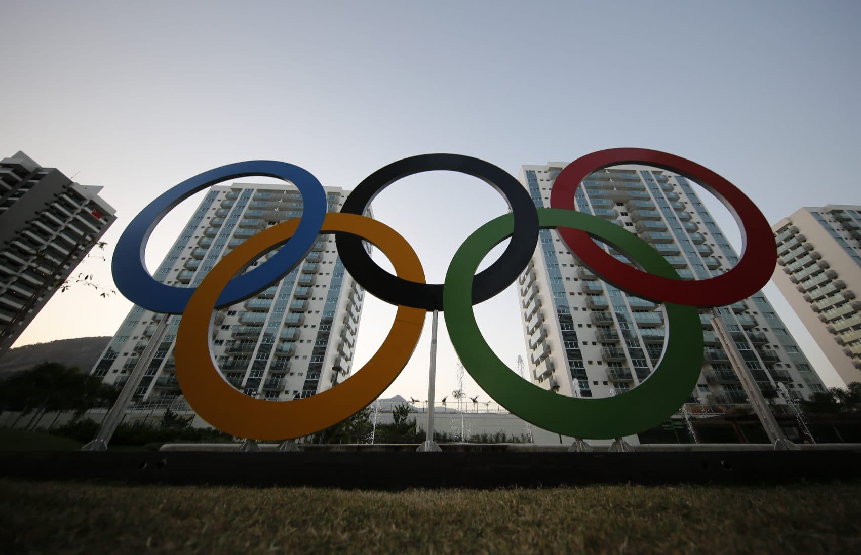 The Olympic rings in front of the Olympic Village in Rio de Janeiro, Brazil. The brand new complex of residential towers are where nearly 11,000 athletes and some 6,000 coaches and other handlers will sleep, eat and train during the games. (Leo Correa/AP)