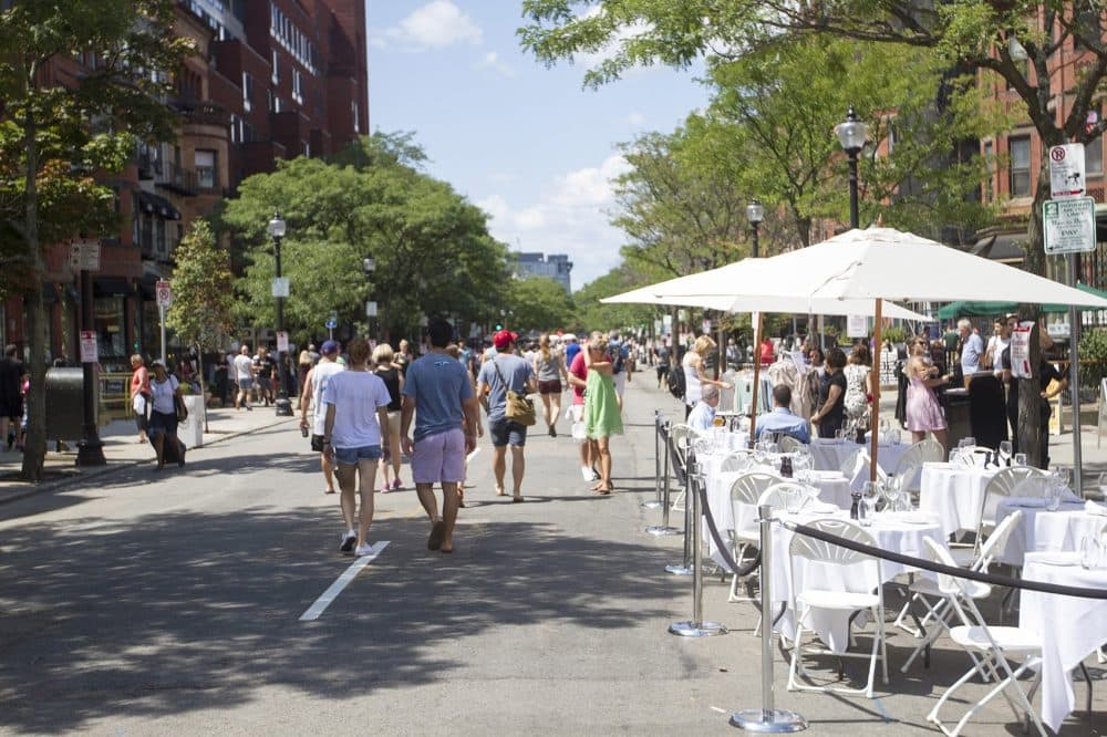 Several restaurants expanded onto the street for the Open Newbury Street event. (Joe Difazio for WBUR)