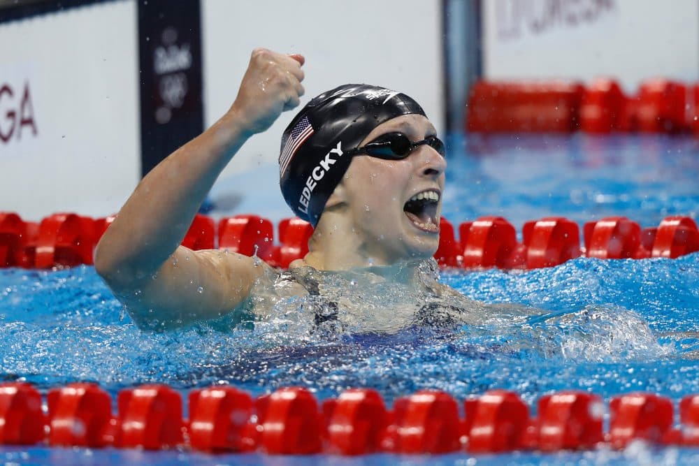 Katie Ledecky of the United States celebrates winning gold and setting a new world record in the Women's 400m Freestyle Final on Day 2 of the Rio 2016 Olympic Games at the Olympic Aquatics Stadium on Aug. 7, 2016 in Rio de Janeiro, Brazil. (Clive Rose/Getty Images)