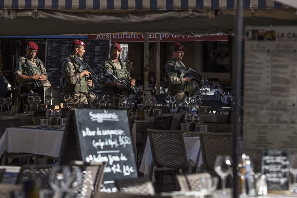 Soldiers walk through the old town past restaurants on Aug. 7, 2016 in Nice, France. (Dan Kitwood/Getty Images)