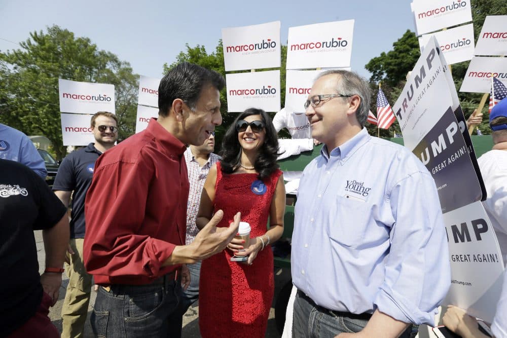 Republican presidential candidate Louisiana Gov. Bobby Jindal talks with Rep. David Young, R-Iowa, right, before walking in a Fourth of July parade in Urbandale, Iowa in 2015. (Charlie Neibergall/AP)