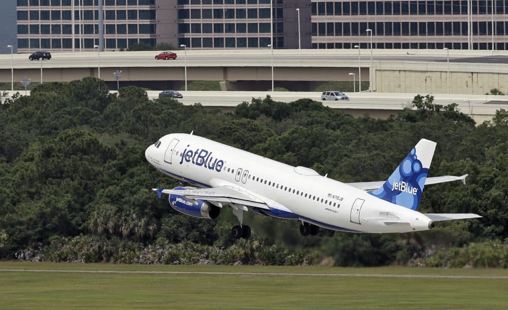 In this Thursday, May 15, 2014, file photo, a JetBlue Airways plane takes off from the Tampa International Airport in Tampa, Fla. (Chris O'Meara, File/AP)