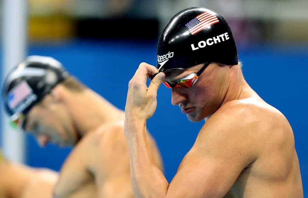 Ryan Lochte, right, and Michael Phelps prepares to compete in the final of the men's 200-meter individual medley during the swimming competitions in Rio. The USOC says Lochte and three other U.S. Olympians were robbed by armed men. (Lee Jin-man/AP)