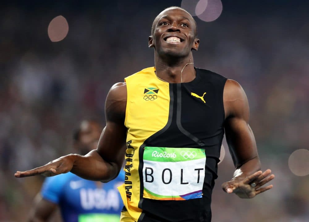 Jamaica's Usain Bolt celebrates as he crosses the finish line to win gold in the men's 100-meter on Sunday in Rio. (Lee Jin-man/AP)