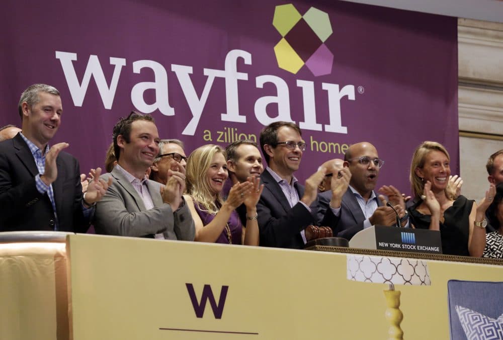 Steve Conine, third from right, and Niraj Shah, second from right, co-chairmen and co-founders of Boston home furnishings online retailer Wayfair, ring the New York Stock Exchange opening bell to mark their company's IPO. (Richard Drew/AP)