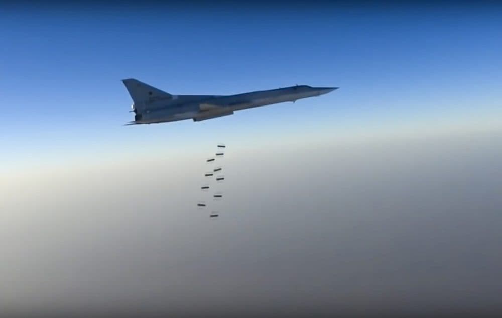 In this frame grab provided by the Russian Defence Ministry Press Service Russian, a long range bomber reportedly flies during an airstrike in an undisclosed location in Syria. (Russian Defence Ministry via AP)