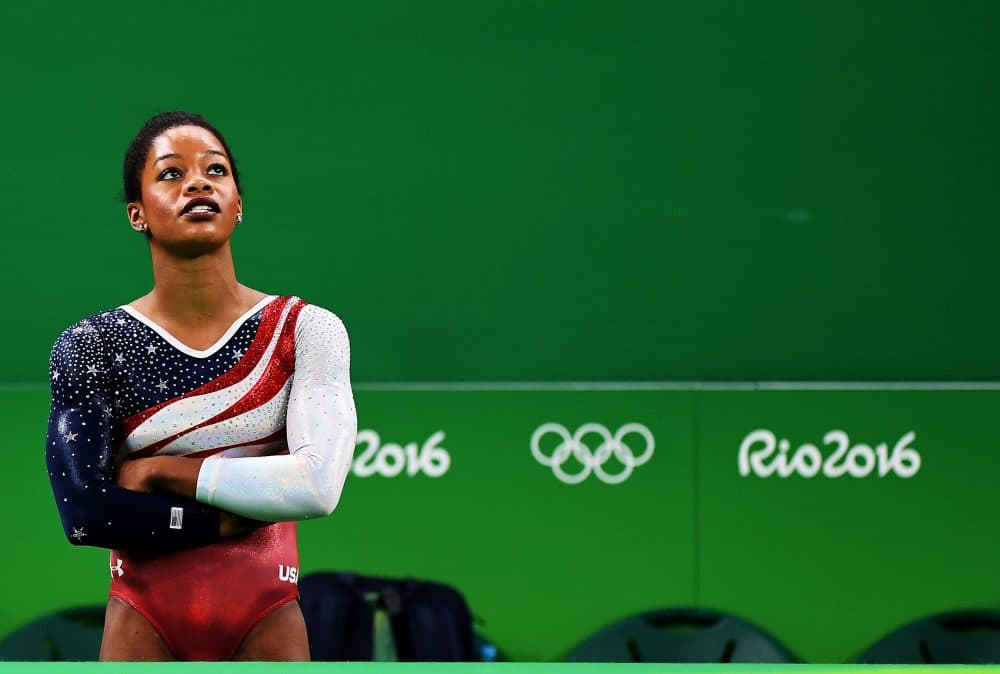 Gabby Douglas of the United States looks on the monitor to display the score at the Rio Olympics on Aug. 9, 2016 in Rio de Janeiro, Brazil. (Laurence Griffiths/Getty Images)