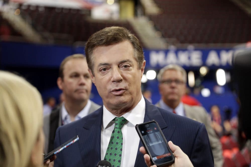 In this July 17, 2016 file photo, Trump Campaign Chairman Paul Manafort talks to reporters on the floor of the Republican National Convention at Quicken Loans Arena in Cleveland. (Matt Rourke/AP)