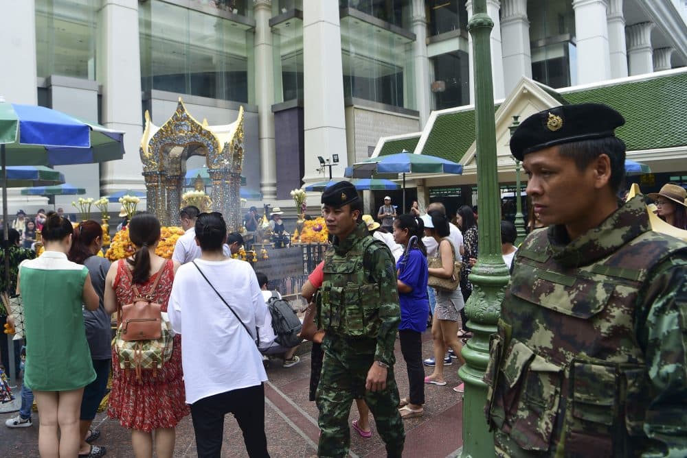 Thai soldiers patrol near the Erawan Shrine, a popular tourist landmark in Bangkok on Aug. 16, 2016, the eve of the first anniversary of a bomb attack that killed 20 people. (Munir Uz Zaman/AFP/Getty Images)