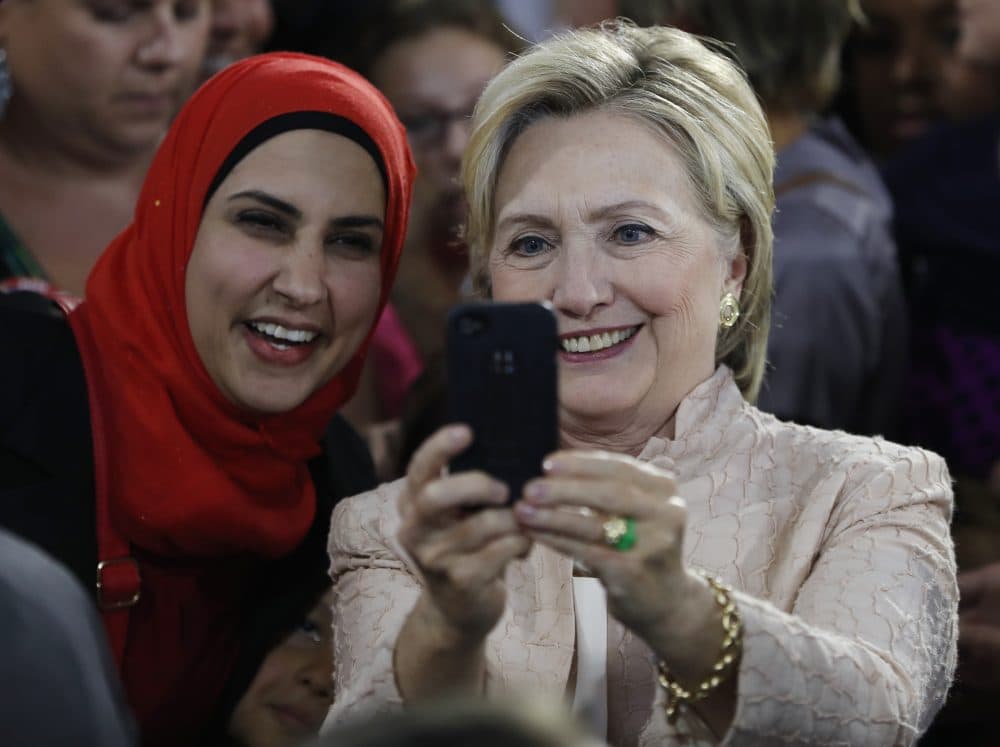 Democratic presidential candidate Hillary Clinton poses for a cell phone photo with a woman in the audience after speaking at campaign event at John Marshall High School in Cleveland, Wednesday, Aug. 17, 2016. (Carolyn Kaster/AP)