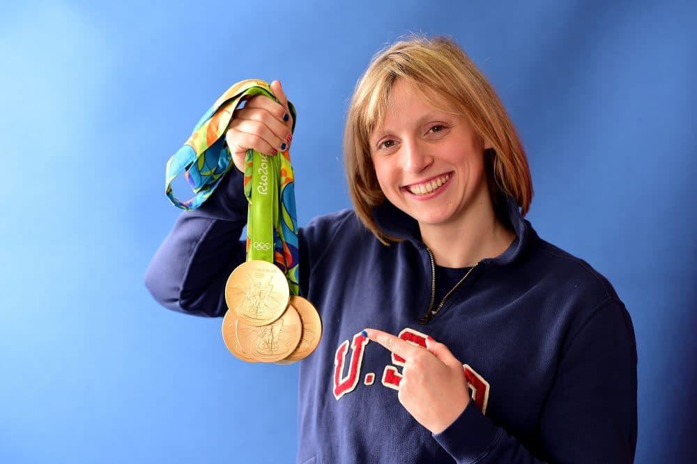 Katie Ledecky shows off her five medals -- four gold and one silver -- from the 2016 Rio Games. (Harry How/Getty Images)