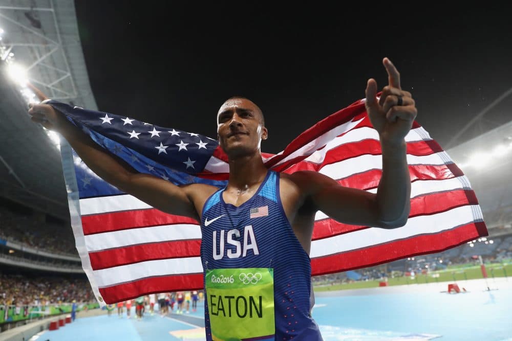 Ashton Eaton of the United States celebrates winning gold overall after the Men's Decathlon 1500m on Day 13 of the Rio 2016 Olympic Games at the Olympic Stadium on Aug. 18, 2016 in Rio de Janeiro, Brazil. (Alexander Hassenstein/Getty Images)