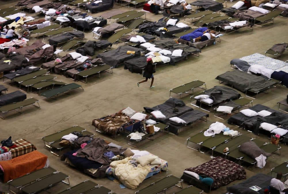 Evacuees take advantage of the shelter setup in the The Baton Rouge River Center arena on Aug. 19, 2016 in Baton Rouge, Louisiana. (Joe Raedle/Getty Images)