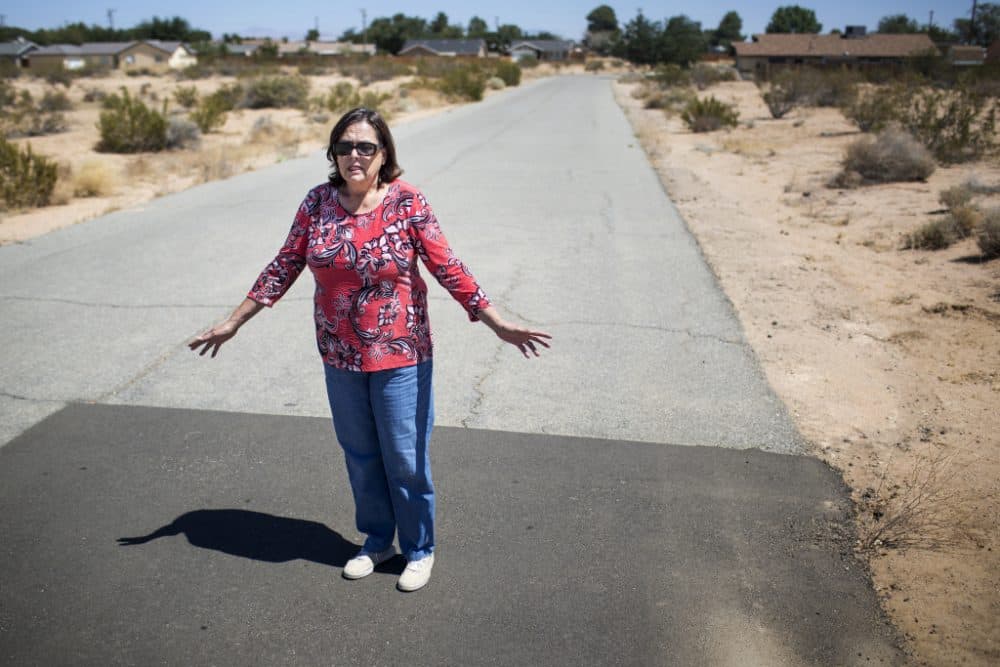 California City Mayor Jennifer Wood stands where a water line blowout occurred in early 2015. With these water line breaks, Wood is worried about residents' safety. (Maya Sugarman/KPCC)