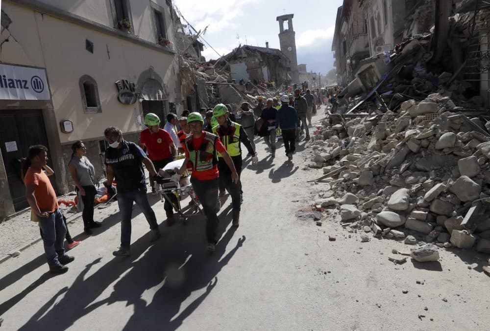 The body of a victim is pulled out of the rubble following an earthquake in Amatrice Italy on Wednesday. (Alessandra Tarantino/AP)