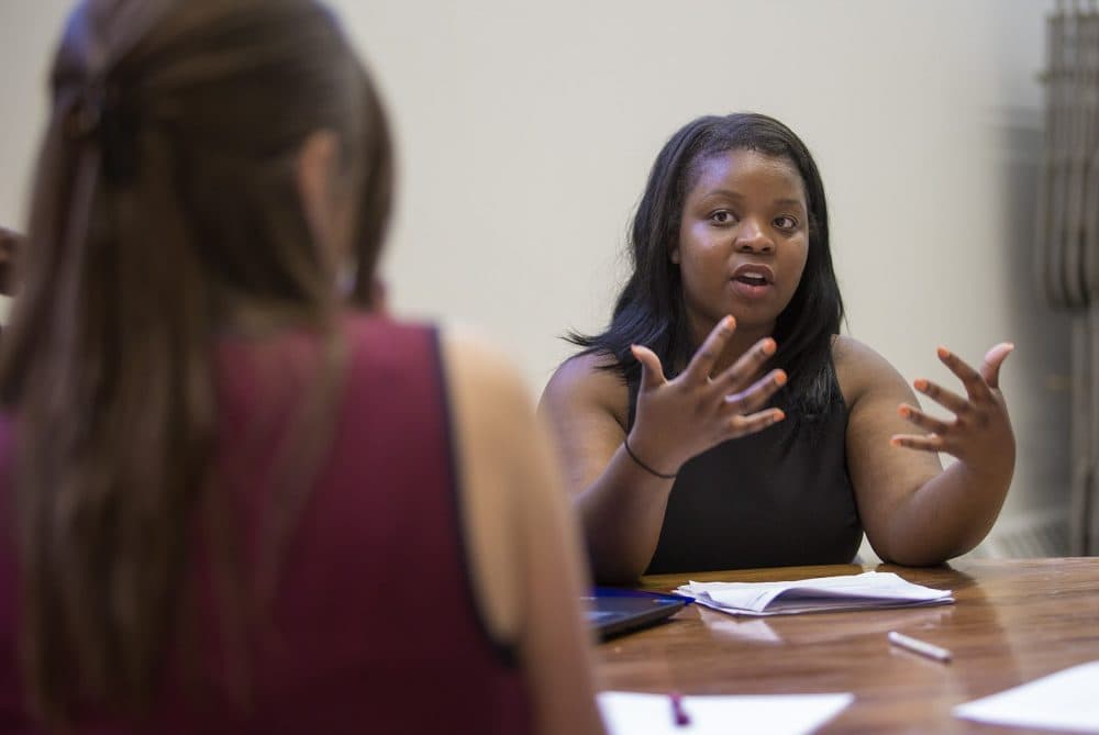 Women, especially black and Latina women, in Greater Boston make less than men. Here, Kristina Desir, a program manager for the American Association of University Women (AAUW), leads a salary negotiation workshop in Dorchester. (Jesse Costa/WBUR/file)