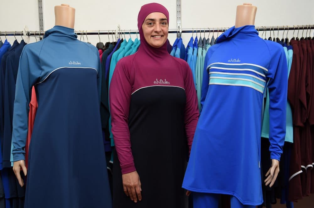 Fitness instructor Fatma Taha wears a burkini swimsuit as she poses for pictures at a shop in western Sydney, Australia on Aug. 19, 2016. (Saeed Khan/AFP/Getty Images)