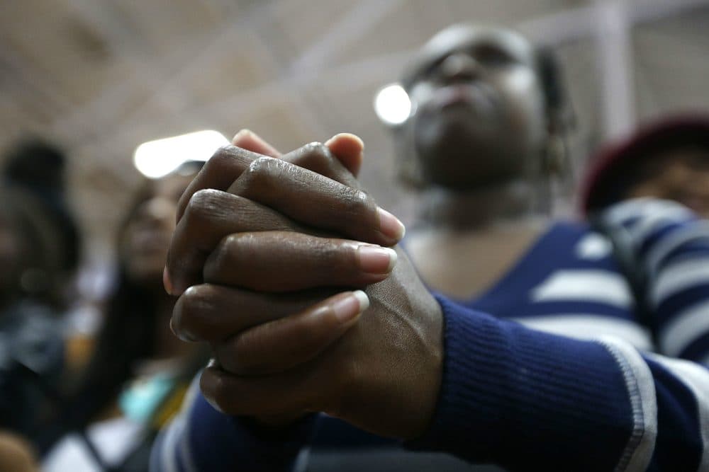 An audience member clasps her hands as she listens to Democratic presidential candidate Hillary Clinton speak at a &quot;Get Out The Vote&quot; rally for historically black colleges and universities, at South Carolina State University in Orangeburg, S.C. on Feb. 26, 2016. (Gerald Herbert/AP)

