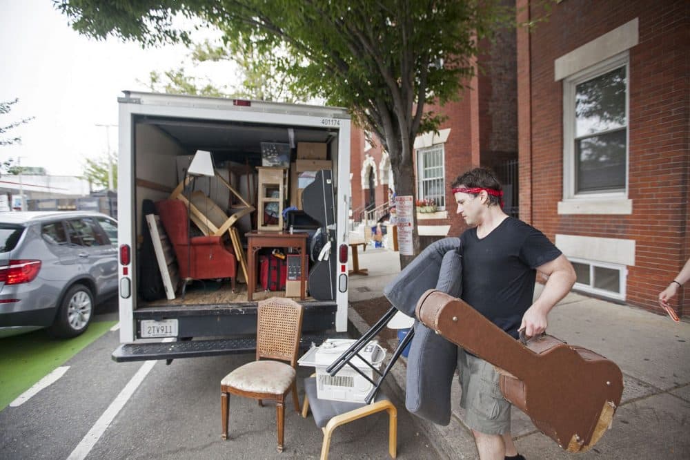 Noah Druckenbrod moves out of his Allston apartment on Wednesday, Aug. 31. (Joe Difazio for WBUR)