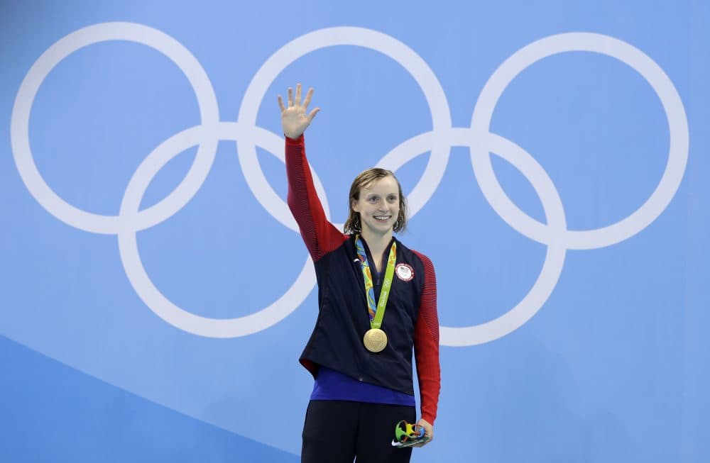 United States' gold medal winner Katie Ledecky celebrates during the medal ceremony after setting a new world record in the women's 400-meter freestyle final during the swimming competitions at the 2016 Summer Olympics, Monday, Aug. 8, 2016, in Rio de Janeiro, Brazil. (Michael Sohn/AP)