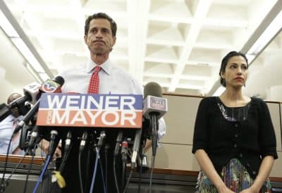 Anthony Weiner stands beside his wife Huma Abedin as he addresses the press about allegations of sexual text messages on July 23, 2013, in New York. (Kathy Willens/AP)

