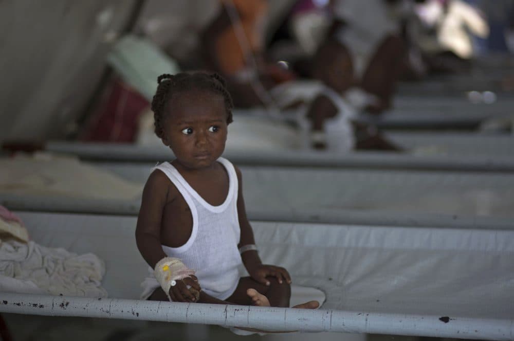 In this Oct. 19, 2011, file photo, a girl receives treatment for cholera symptoms at a Doctors Without Borders cholera clinic in Port-au-Prince, Haiti. A U.S. federal appeals court has upheld the United Nations’ immunity from a damage claim filed on behalf of 5,000 cholera victims who blame the U.N. for an epidemic of the deadly disease in Haiti. (AP Photo/Ramon Espinosa)