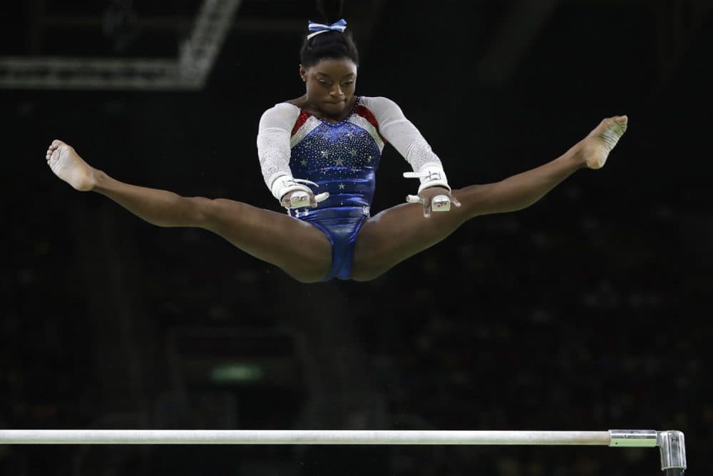 United States' Simone Biles performs on the uneven bars during the artistic gymnastics women's individual all-around final at the 2016 Summer Olympics in Rio de Janeiro, Brazil. (Dmitri Lovetsky/AP)