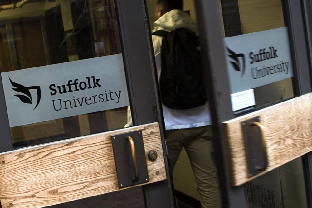 After the firing of Suffolk President Margaret McKenna in late July, what will be the future of the university? Pictured here: a student enters the Donahue Building at Suffolk University. (Jesse Costa/WBUR)