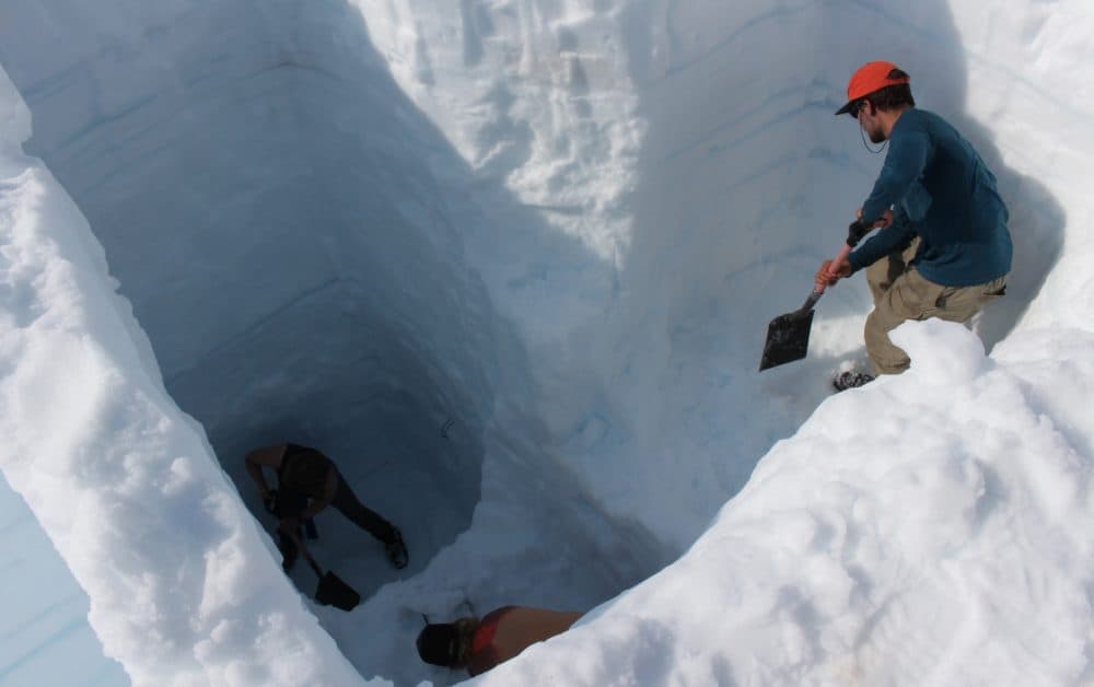 Students dig a mass balance pit on the Juneau Icefield. (Elizabeth Jenkins/KTOO)