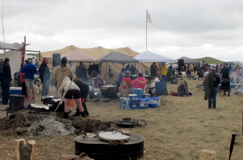 People protesting the construction on a four-state oil pipeline at a site in southern North Dakota gather at campground near the Standing Rock Sioux reservation on Thursday, Aug. 25, 2016. (James MacPherson/AP)