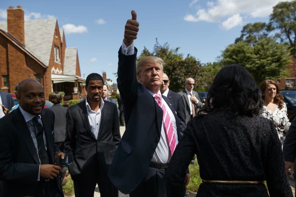 Republican presidential candidate Donald Trump gives a thumbs up during a visit to the childhood home of Dr. Ben Carson, Saturday, Sept. 3, 2016, in Detroit. (Evan Vucci/AP)