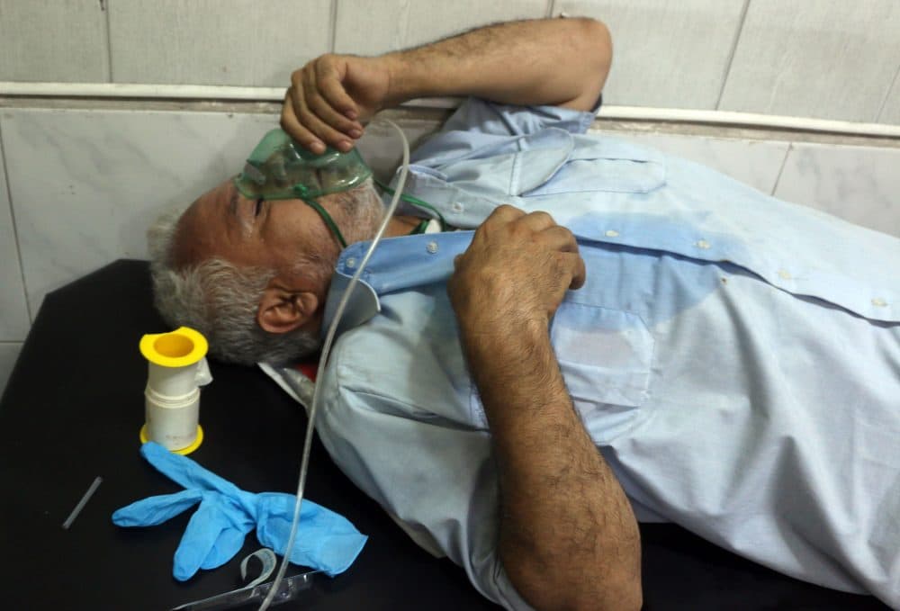 A Syrian man suffering from breathing difficulties is treated at a make-shift hospital in Aleppo after regime helicopters allegedly dropped barrel bombs on the rebel-held Sukkari neighbourhood of the northern Syrian city on Sept. 6, 2016. (Thaer Mohammed/AFP/Getty Images)
