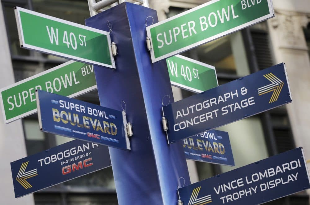 In the U.S., it's hard to avoid crossing paths with the NFL. (Mark Lennihan/AP)