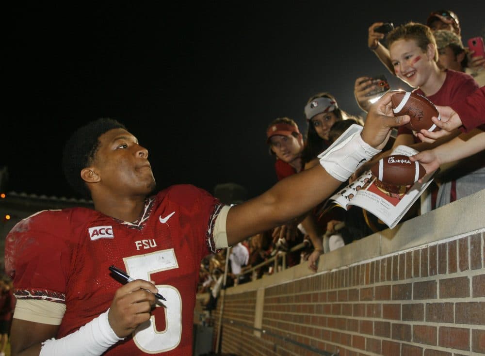 In this Saturday, Nov. 23, 2013 file photo, then-Florida State quarterback Jameis Winston signs autographs after an NCAA college football game against Idaho, in Tallahassee, Fla. After an FSU student accused Winston of rape in 2012, the police did not interview him or obtain his DNA. (Phil Sears/AP)