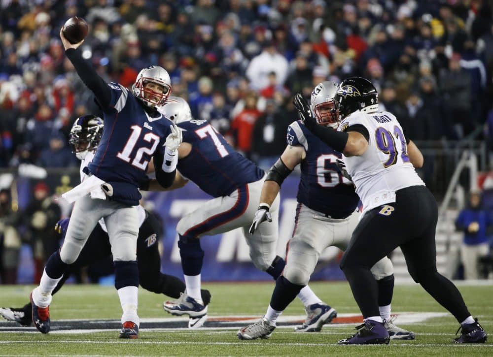 Patriots quarterback Tom Brady passes over Baltimore Ravens defensive end Haloti Ngata (92) in the second half of an NFL divisional playoff football game Jan. 10, 2015, in Foxborough. (Elise Amendola/AP)