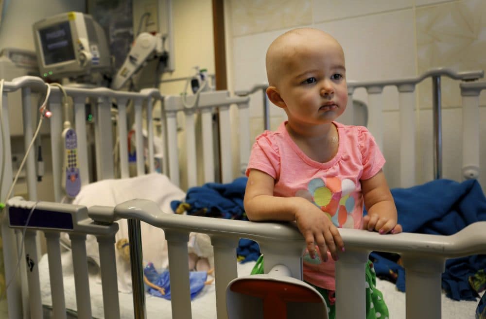 Talia Pisano stands in her bed at Lurie Children's Hospital on June 11, 2015. Talia is getting tough treatment for kidney cancer. She's also getting a chance at having babies of her own someday. To battle infertility sometimes caused by cancer treatment, some hospitals are trying a new approach: freezing immature ovary and testes tissue, with hopes of being able to put it back when patients reach adulthood and want to start families. (Christian K. Lee/AP)