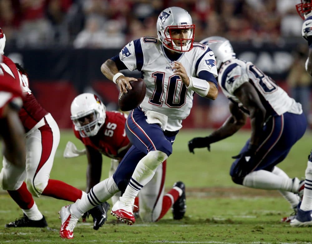 New England Patriots quarterback Jimmy Garoppolo (10) scrambles against the Arizona Cardinals during the second half of an NFL football game on Sunday in Glendale, Ariz. (Ross D. Franklin/AP)