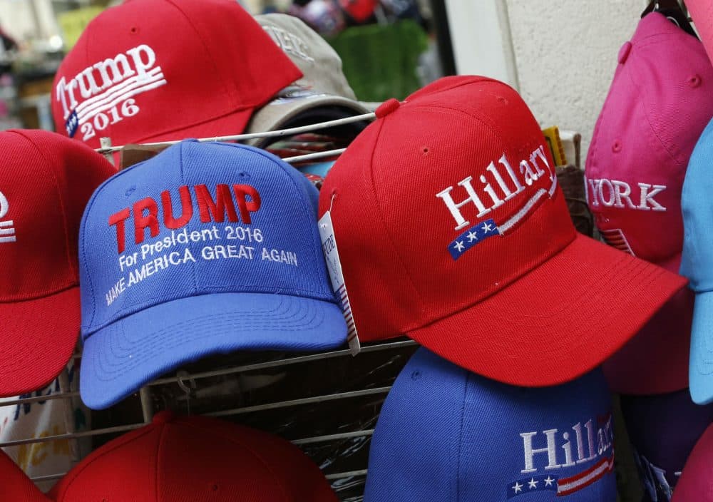 Hats displaying support for Republican presidential candidate Donald Trump and his Democratic opponent Hillary Clinton are displayed by a sidewalk vendor, Tuesday, Aug. 16, 2016, in New York. (Mark Lennihan/AP)


