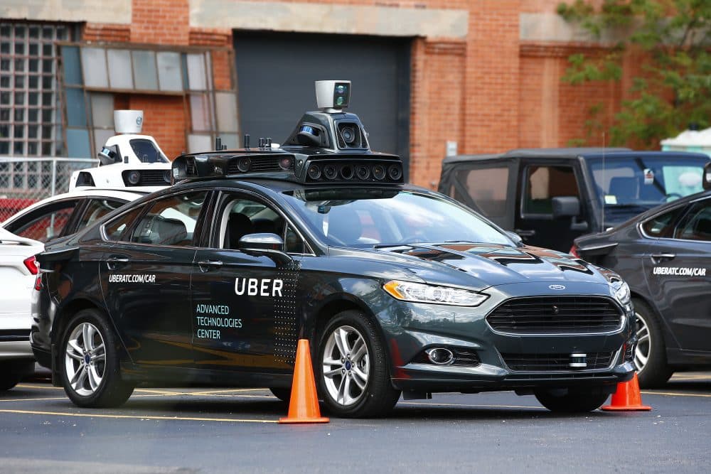 A self-driving Ford Fusion hybrid car sits parked on Aug. 18, 2016 in Pittsburgh. Uber said that passengers in Pittsburgh will be able to summon rides in self-driving cars with the touch of a smartphone button in the next several weeks. (Jared Wickerham/AP)