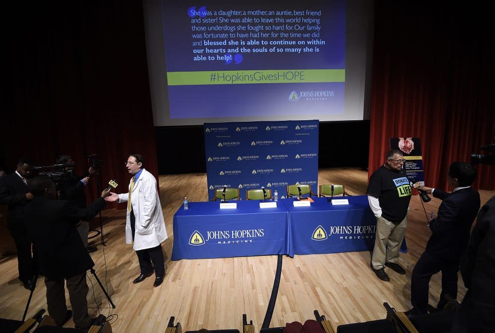 Dorry Segev, left, and Morris Murray, previous liver transplant recipient, are interviewed about the first ever HIV-positive liver transplant in the world after a news conference at Johns Hopkins hospital, March 30, 2016 in Baltimore. (Gail Burton/AP)