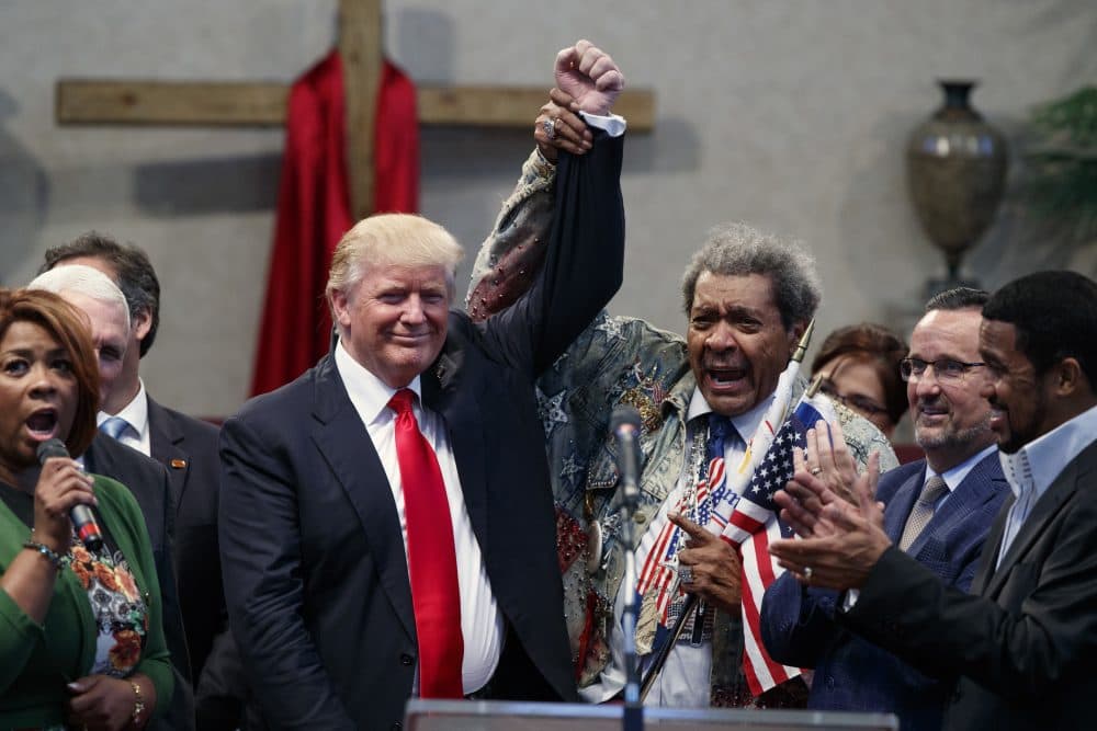 Boxing promoter Don King, right, holds up the hand of Republican presidential candidate Donald Trump during a visit to the Pastors Leadership Conference at New Spirit Revival Center, Wednesday, Sept. 21, 2016, in Cleveland, Ohio. (Evan Vucci/AP)