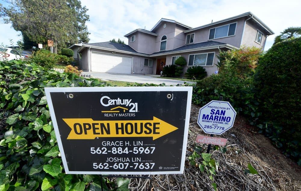 An open house sign directs prospective buyers to a property for sale in Monterey Park, Calif., on April 19, 2016. (Frederic J. Brown/AFP/Getty Images)