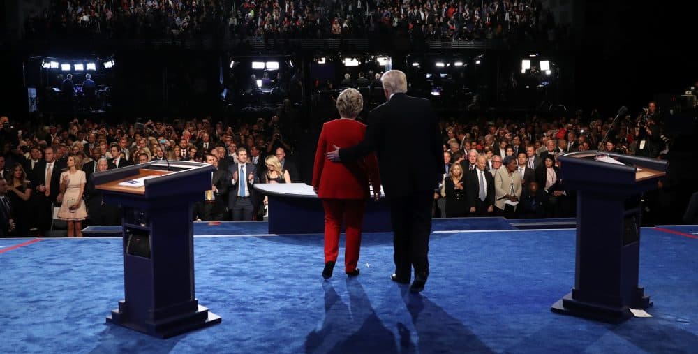 Democratic nominee Hillary Clinton (left) and Republican nominee Donald Trump greet the audience at the end of the first presidential debate at Hofstra University in Hempstead, New York on Sept. 26, 2016. (Joe Raedle/AFP/Getty Images)